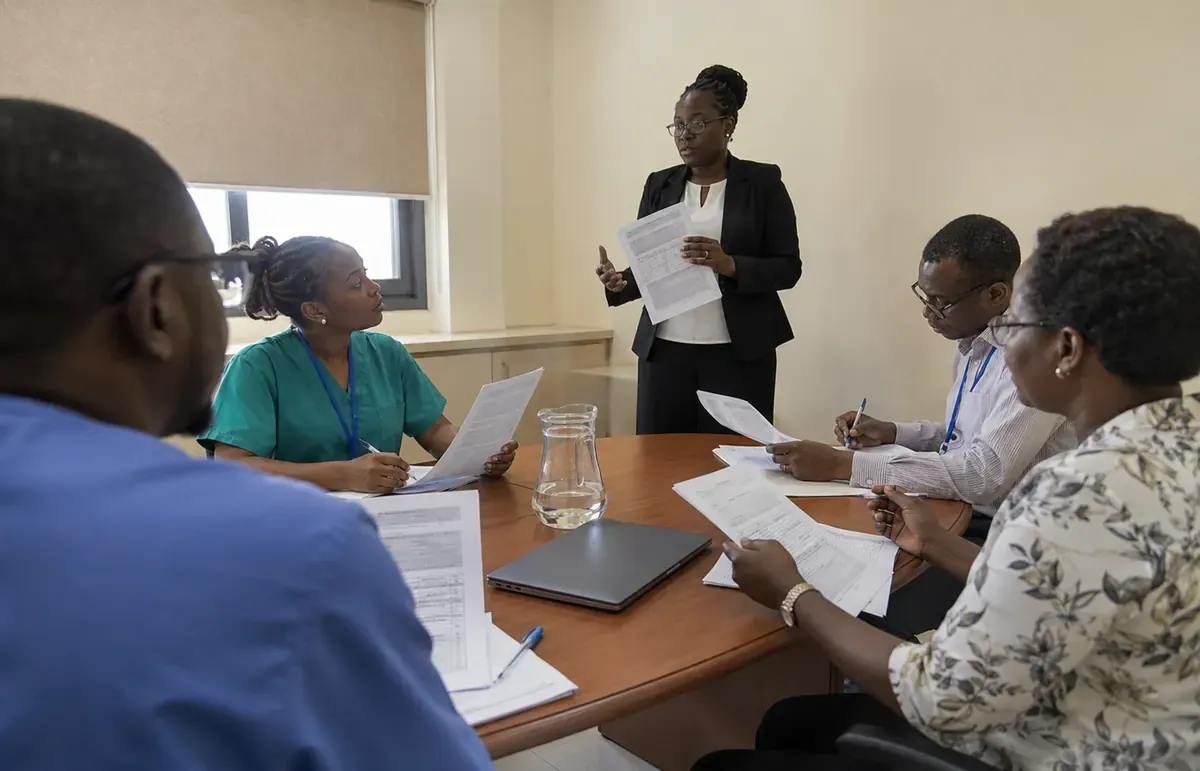 Clinical governance team reviewing quality documentation
